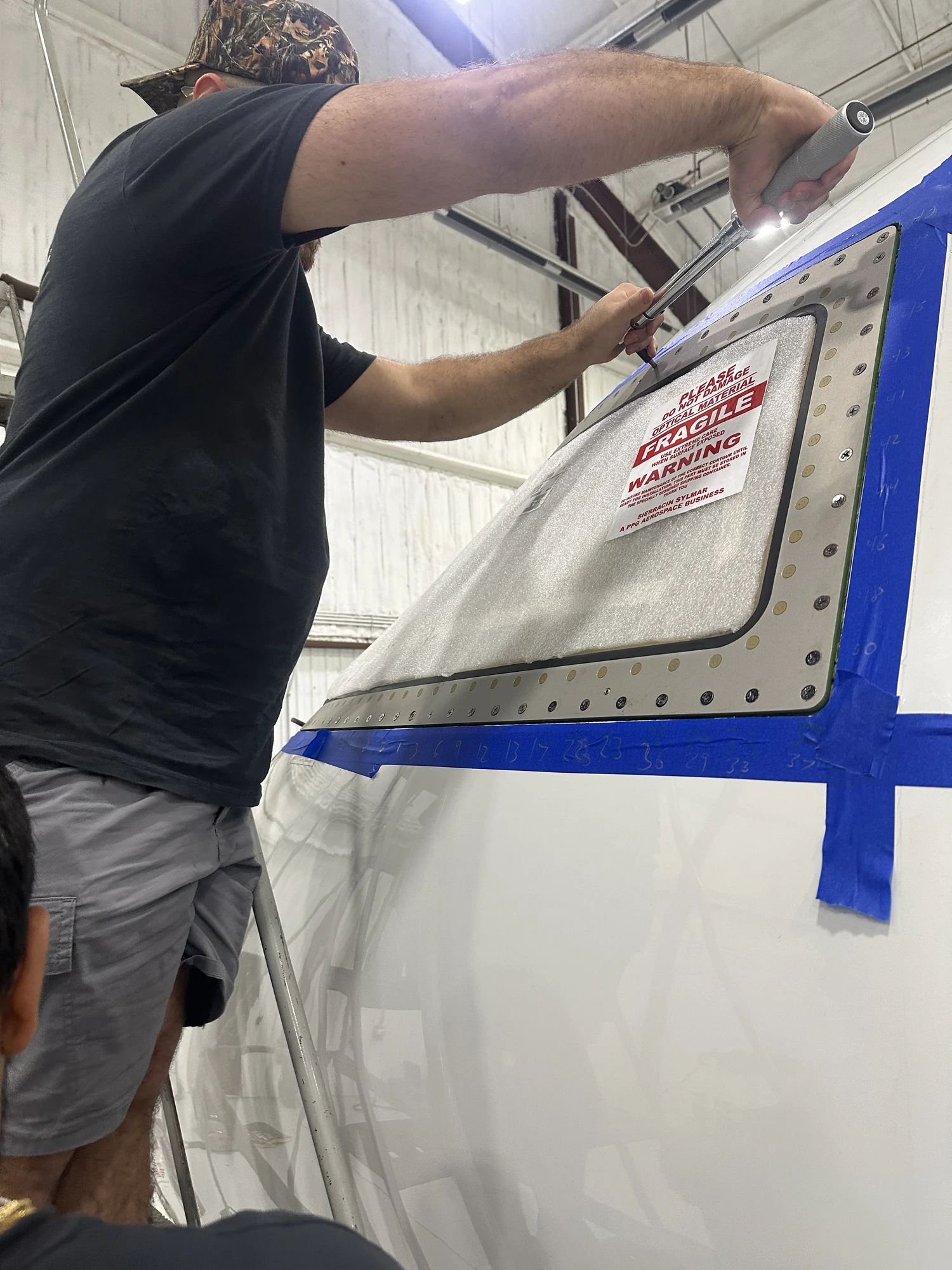 Aeroluxe technician working on the Global 5000 windshield